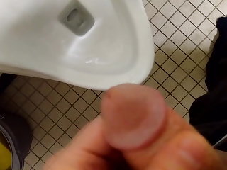 Belure Blasting a huge load over a urinal